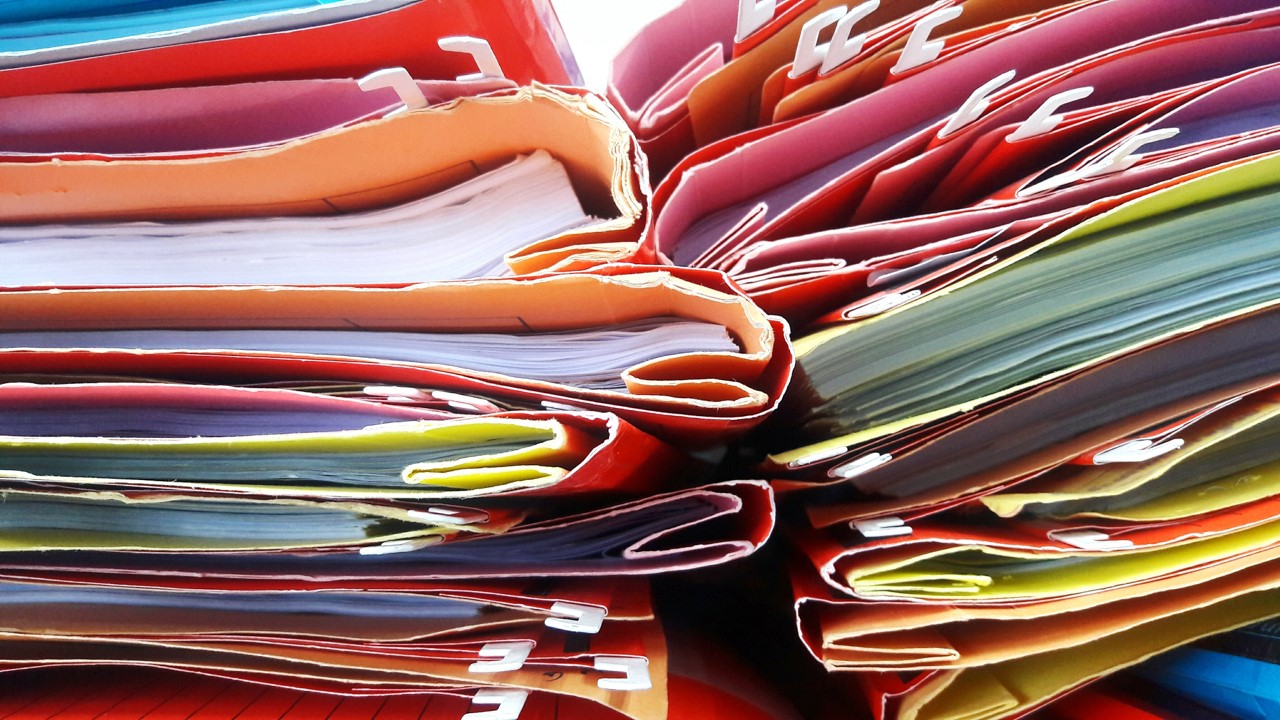 Pile of routinely collected paperwork representing data